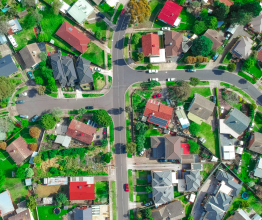 Aerial photo of suburban houses and streets.