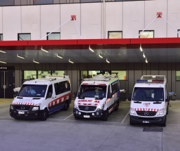 Three ambulances parked outside the Box Hill Hospital emergency department.
