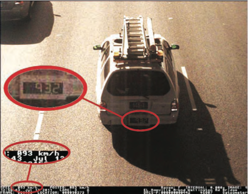 Calibrated test vehicles have a large speed display at the back of the vehicle. As the vehicle travels past the speed camera, it is detected and photographed by the speed camera. This allows the speed camera measurement and the calibrated vehicle measurement to be compared.  This is shown in this photograph.