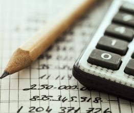 Image shows calculator and pencil. Photo courtesy of sebra/Shutterstock.com